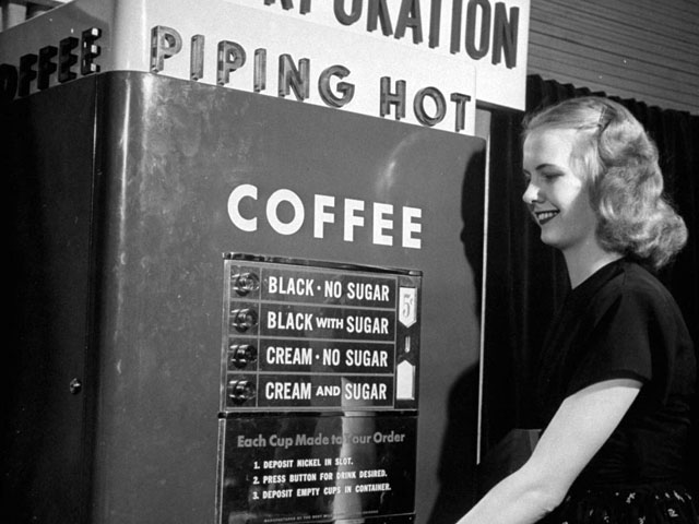 Vintage coin-operated coffee machine, 1947